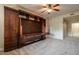 Bedroom featuring a built-in Murphy bed, storage cabinets, ceiling fan and carpet flooring at 5350 E Deer Valley Dr # 1433, Phoenix, AZ 85054