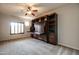 Bedroom featuring a built-in Murphy bed, storage cabinets, ceiling fan and window with shutter at 5350 E Deer Valley Dr # 1433, Phoenix, AZ 85054