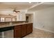 Kitchen counter with stainless steel dishwasher and view to spacious living area with tile floors at 5350 E Deer Valley Dr # 1433, Phoenix, AZ 85054