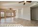 Bright and open living room with tile floors, multiple windows and ceiling fans at 5350 E Deer Valley Dr # 1433, Phoenix, AZ 85054