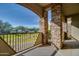 Spacious covered patio with stone pillars and views of manicured green space creating a relaxing outdoor retreat at 5350 E Deer Valley Dr # 1433, Phoenix, AZ 85054