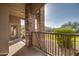 Charming covered patio with stone accents and lush landscape, perfect for relaxing and outdoor entertainment at 5350 E Deer Valley Dr # 1433, Phoenix, AZ 85054