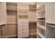 Spacious walk-in closet with ample shelving, drawers and hanging space for clothing and accessories at 5350 E Deer Valley Dr # 1433, Phoenix, AZ 85054