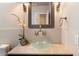 Elegant bathroom featuring a vessel sink, marble countertop, and decorative mirror at 6438 E Claire Dr, Scottsdale, AZ 85254