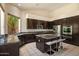 Well-equipped kitchen featuring granite countertops, stainless steel appliances, and ample storage space at 6438 E Claire Dr, Scottsdale, AZ 85254