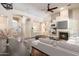 Open-concept living area with fireplace, TV, and modern decor, creating a seamless flow and inviting atmosphere at 6438 E Claire Dr, Scottsdale, AZ 85254