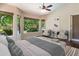 Comfortable main bedroom with large windows and stylish furnishings, offering a relaxing and elegant ambiance at 6438 E Claire Dr, Scottsdale, AZ 85254
