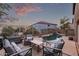 Backyard featuring patio furniture, a pool, and a beautiful evening sky at 7500 E Deer Valley Rd # 157, Scottsdale, AZ 85255