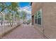 View of the backyard with a gravel-covered area enclosed by a fence and landscaped desert vegetation at 7500 E Deer Valley Rd # 157, Scottsdale, AZ 85255
