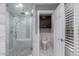 Modern bathroom featuring a glass enclosed shower, neutral tile work, and a toilet in a separate alcove at 7500 E Deer Valley Rd # 157, Scottsdale, AZ 85255
