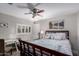 Bright bedroom with a wooden bed frame, shuttered window, and a ceiling fan for maximum comfort at 7500 E Deer Valley Rd # 157, Scottsdale, AZ 85255