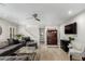 Open concept living room featuring a ceiling fan and hardwood floors at 7500 E Deer Valley Rd # 157, Scottsdale, AZ 85255