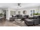 Bright and airy living room featuring neutral walls and a large sectional sofa at 7500 E Deer Valley Rd # 157, Scottsdale, AZ 85255