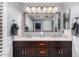 Well-lit main bathroom featuring double vanity, marble countertops and dual sinks at 7500 E Deer Valley Rd # 157, Scottsdale, AZ 85255