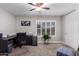 Office area with desk, printer, filing cabinet, shutters on the window, and ceiling fan at 7500 E Deer Valley Rd # 157, Scottsdale, AZ 85255