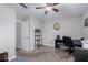 Office area with desk, printer, filing cabinet, shutters on the window, and ceiling fan at 7500 E Deer Valley Rd # 157, Scottsdale, AZ 85255