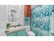 Charming bathroom featuring colorful decor, tiled vanity, and stylish fixtures at 7841 E Stonecliff Cir, Mesa, AZ 85207