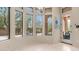 Bright breakfast nook with pool views through the large windows, tiled floors and access to patio at 7841 E Stonecliff Cir, Mesa, AZ 85207