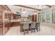 Gourmet kitchen featuring custom cabinets, stainless steel appliances, granite countertops, and a center island at 7841 E Stonecliff Cir, Mesa, AZ 85207