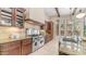 Spacious kitchen featuring custom cabinets, stainless steel appliances, granite countertops, and center island at 7841 E Stonecliff Cir, Mesa, AZ 85207