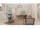 Living room with fireplace, neutral paint, tile floors, and elegant decor at 7841 E Stonecliff Cir, Mesa, AZ 85207