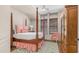 Beautiful main bedroom with four poster bed, natural light and hardwood floors at 7841 E Stonecliff Cir, Mesa, AZ 85207