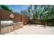 Outdoor stainless steel grill and counter area against a block wall and patio at 7841 E Stonecliff Cir, Mesa, AZ 85207