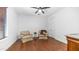 Cozy sitting room with comfortable chairs, hardwood floors, and natural light at 7841 E Stonecliff Cir, Mesa, AZ 85207