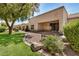 Backyard with desert landscaping, a stone bench, and covered patio. The space has lots of possibilities at 8874 W Piute Ave, Peoria, AZ 85382