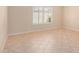 Bright, airy bedroom with natural light and tiled floors at 8874 W Piute Ave, Peoria, AZ 85382