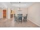Dining room featuring a chandelier, tile floors and a light colored wall at 8874 W Piute Ave, Peoria, AZ 85382