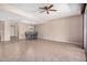 Open dining room with tiled floors, a decorative ceiling and a view into another room at 8874 W Piute Ave, Peoria, AZ 85382