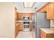Well-equipped kitchen featuring stainless steel appliances and abundant cabinet space at 8874 W Piute Ave, Peoria, AZ 85382