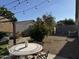Cozy backyard featuring a pergola, string lights, desert landscaping, and gravel at 8927 W Paradise Dr, Peoria, AZ 85345