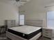 Bedroom featuring a queen sized bed, ceiling fan and neutral walls and carpet at 8927 W Paradise Dr, Peoria, AZ 85345