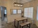 Bright dining area with modern light fixture and a table with bench seating at 8927 W Paradise Dr, Peoria, AZ 85345