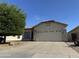 Attractive single-story home featuring a low maintenance desert front yard and an attached two-car garage at 8927 W Paradise Dr, Peoria, AZ 85345