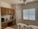 Kitchen area featuring a wine rack, built-in cabinets and bright natural light at 8927 W Paradise Dr, Peoria, AZ 85345