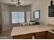 Eat-in kitchen with breakfast bar, counter seating, and bright natural light at 8927 W Paradise Dr, Peoria, AZ 85345