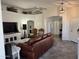 Spacious living room featuring tile floors, vaulted ceilings, and an open layout at 8927 W Paradise Dr, Peoria, AZ 85345