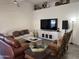 Inviting living room with neutral walls, tile floors, ceiling fan and comfortable seating at 8927 W Paradise Dr, Peoria, AZ 85345