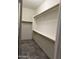 Spacious walk-in closet with custom shelving for optimal storage and organization at 8927 W Paradise Dr, Peoria, AZ 85345