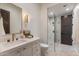 Modern bathroom with dual shower heads in a seamless glass shower at 9456 E Sands Dr, Scottsdale, AZ 85255