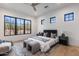 Comfortable bedroom with large windows showcasing desert landscape views at 9456 E Sands Dr, Scottsdale, AZ 85255