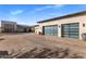Spacious garage with glass panel doors, and a brick driveway at 9456 E Sands Dr, Scottsdale, AZ 85255
