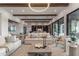 Open concept living room with wood-beam ceilings, recessed lighting, and access to the outdoor living space at 9456 E Sands Dr, Scottsdale, AZ 85255