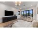 This main bedroom has access to the outdoors and features hardwood floors at 9456 E Sands Dr, Scottsdale, AZ 85255