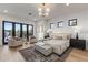 Bright main bedroom features hardwood floors, a sitting area and natural light at 9456 E Sands Dr, Scottsdale, AZ 85255