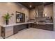 Modern outdoor kitchen features stainless steel appliances, ample counter space, and stylish cabinetry for seamless entertaining at 9456 E Sands Dr, Scottsdale, AZ 85255