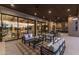 Elegant outdoor living area with comfortable seating, wood ceiling, and access to indoor living spaces at 9456 E Sands Dr, Scottsdale, AZ 85255